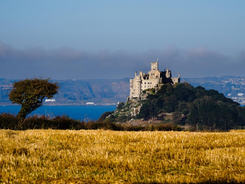 St Michaels mount in Cornwall with golden corn in front