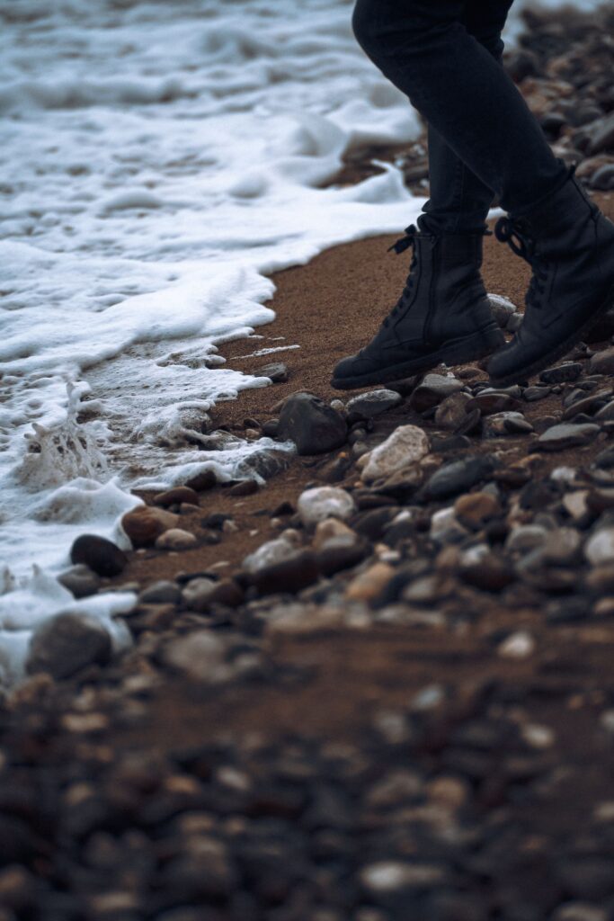 boots of the sand and waves